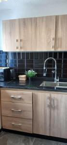 a kitchen with a sink and a counter top at Precioso estudio a pie de playa in Cabo Negro