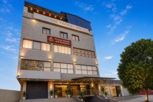 a building with a sign that reads the forbidden hotel at Triotel Inn in Dhanbād