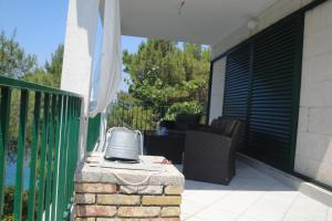 a balcony with a heater on a patio at Apartment Nono Ivo in Vis