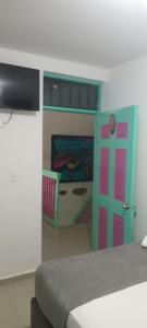 a bedroom with a bunk bed and a door at Hostal Johnnier Macao Punta Cana in Punta Cana