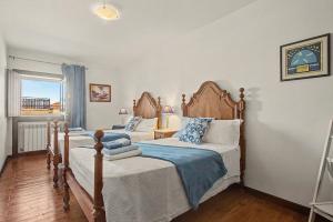 a bedroom with two beds and a window at Casa Da Redouça in Cedrim +28 photos