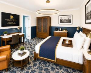 a hotel room with a bed and a desk at Downing College in Cambridge