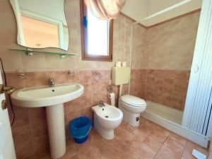 a bathroom with a sink and a toilet at Residence Perla - Salve in Salve