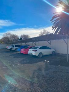 a group of cars parked in a parking lot at Heart Viedma in Viedma