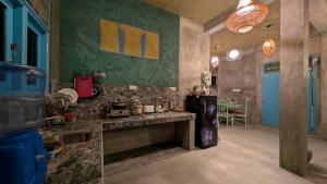 a kitchen with a counter and a table in a room at Soul Villas in Tangalle +227 photos
