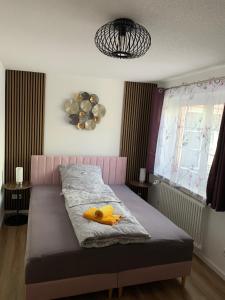 a bedroom with a bed with two bananas on it at Loggia in Stockach