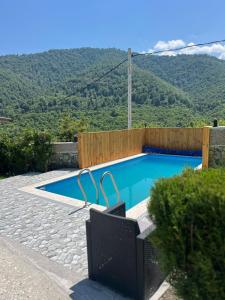 a swimming pool with a view of a mountain at Gald Garden in Dilijan