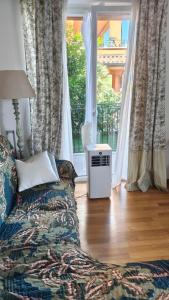 a living room with a couch in front of a window at Bella casa con vista panoramica in Colonno