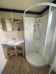 a bathroom with a shower and a sink at Camping 3 étoiles - Piscine - ccbgaia in Châtel-Chéhéry