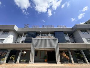 a building with a sign on top of it at Yeza Garden Hotel in Nairobi