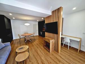 a living room with a couch and a table at BR Silgar Club in Sanxenxo
