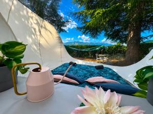 a view from a tent with a flower on a table at FUGA ROMANTICA - Panoramica in Almese +11 photos