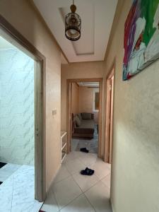 a hallway with a living room and a couch at Sunset Stay Anza in Agadir