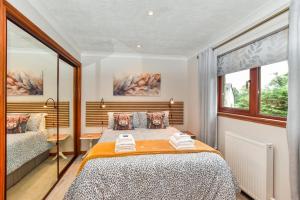 a bedroom with a bed and a window at 1 Bed in Dollar oc-95872 in Powmill