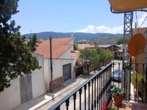 a view of a street from a balcony of a house at Casa rural el cerrete in Riópar