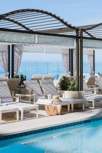 a rendering of a pool with lounge chairs and a swimming pool at Surf & Sand Laguna Beach in Laguna Beach