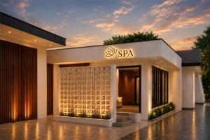 a building with a spa sign on the front of it at Metro Park View Hotel Kota Lama Semarang in Semarang