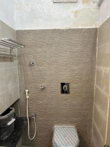 a bathroom with a toilet and a shower at AAC in Chennai +74 photos