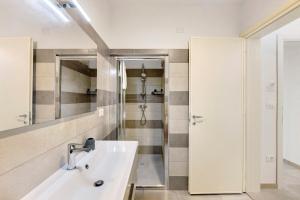 a bathroom with a sink and a shower at L'Aurora Bed and Breakfast in Ugento +36 photos