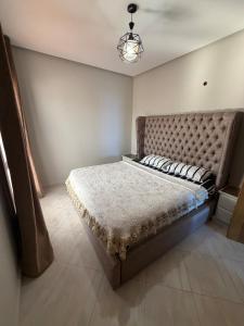 a bedroom with a large bed in a room at Panoramic Sea View Apartment in Riffiene