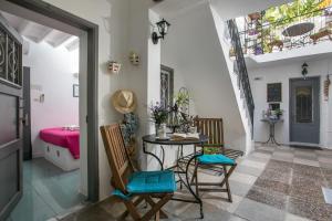 a room with a table and chairs and a sink at Medieval Inn in Rhodes Town