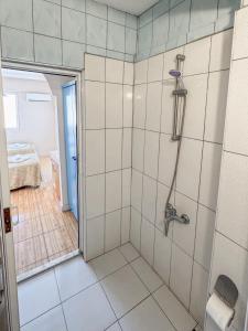 a bathroom with a shower with a shower at Er-öz Hotel & Restaurant in Fethiye +79 photos