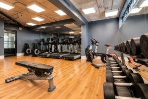 a gym with treadmills and cardio machines at Elegant Sailboat Stay in Key West