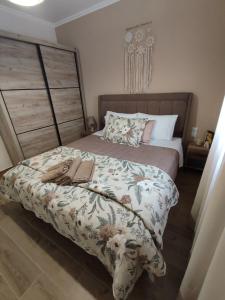 a bedroom with a bed with a book on it at Evita's House in Doxato