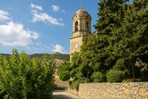 a clock tower on top of a building at Cal Gironell in Santa María de Meyá
