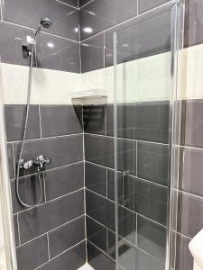 a shower with a glass door in a bathroom at Casa Mare Oureah in Mazagran +42 photos