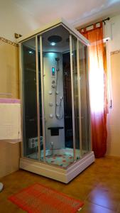 a shower in a bathroom with a glass enclosure at La Piccola Siesta b&b in Montepulciano