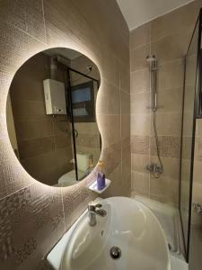 a bathroom with a sink and a mirror at Rent house b8 in Madinaty +37 photos
