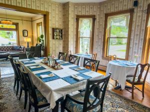 a dining room with a long table and chairs at The Governor's Inn in Ludlow