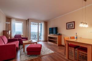 a living room with a couch and a table at Hafendomicil Appartement WH06 - Hase in Waren