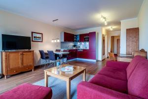 a living room with a couch and a table at Hafendomicil Appartement WH07 - Fuchs in Waren