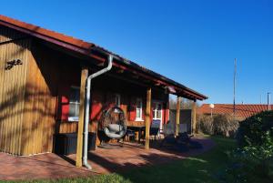 a house with a roof with a patio at Ferienhaus Jabel 28 in Jabel