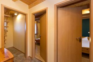 a door leading into a room with a bedroom at Ferienhaus Jabel 28 in Jabel