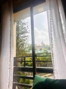 a window with a view of the view from a house at Haku Haven in Baguio