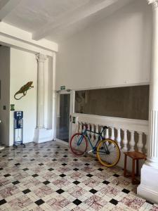 a bike parked on a wall in a room at Casa 1811 in Cartagena de Indias