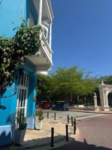 a blue building on the side of a street at Casa 1811 in Cartagena de Indias +48 photos