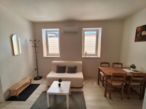 a living room with a couch and a table at Za hrází Poděbrady in Poděbrady +16 photos