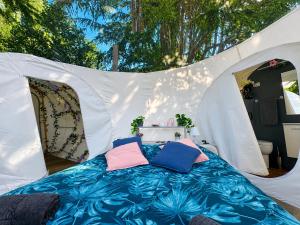 a white tent with a bed in it at FUGA ROMANTICA - Panoramica in Almese