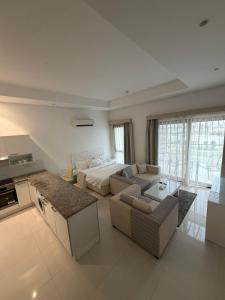 a large living room with a couch and a table at Hawana Studio in Salalah