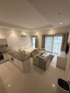 a large living room with a couch and a table at Hawana Studio in Salalah
