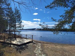 a dock on the shore of a lake at Kelola Cottage in Keyritty
