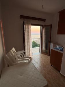 a living room with a view of the ocean at Villa Denis Gjeta in Borsh