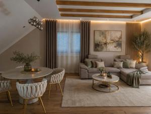 a living room with a couch and a table at Waldresidenz Lutz in Bad Lippspringe