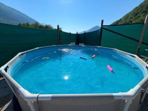 a large pool of water with buoys in it at Pliva Escape in Jezero +20 photos
