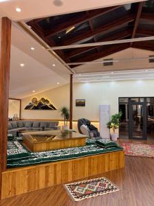 a living room with a couch and a table at 2149 Hotel in Khorog
