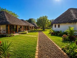 a row of cottages in a resort at ITAMPOLO Suites & Lodges in Nosy Be